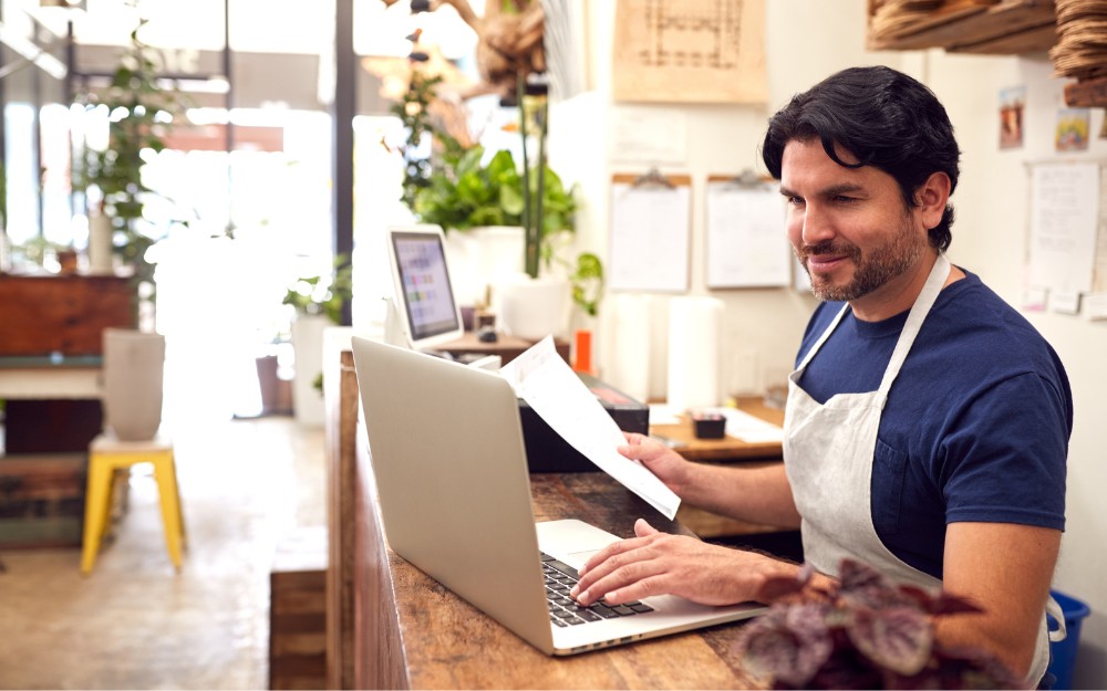 Male business owner using Xero to streamline payroll processing