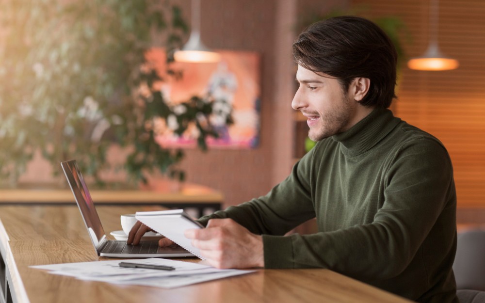 Man working on a computer, thinking, "Grow Your Wealth: Simple Tricks for Fast Financial Growth"