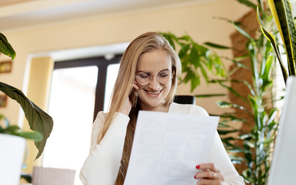 White female employee reading about fair entitlements guarantee