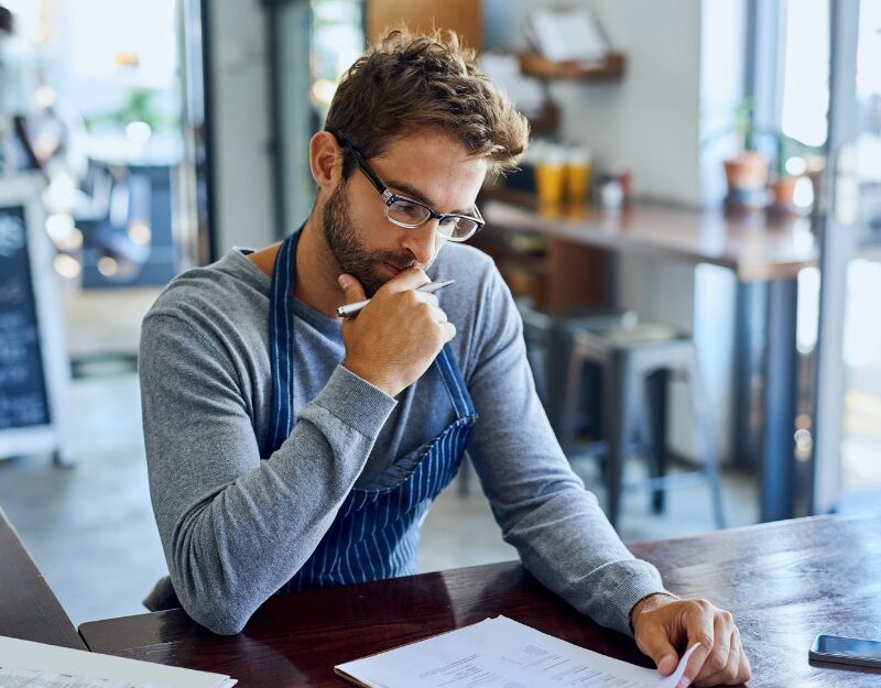 Small business owner thinking about cash flow problems