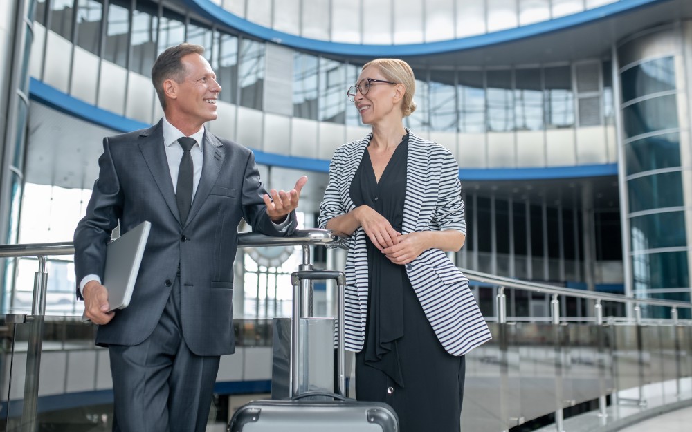 Businesspersons in the airport and aware of overseas travel tax deduction