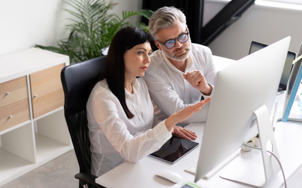 Two owners talking about cybersecurity for small business