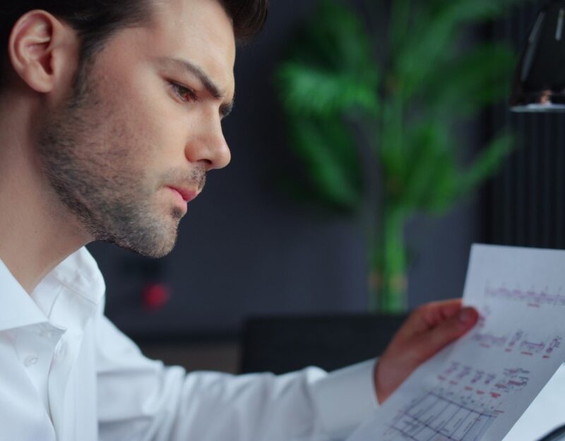 Businessman holding a report while working on payg instalments